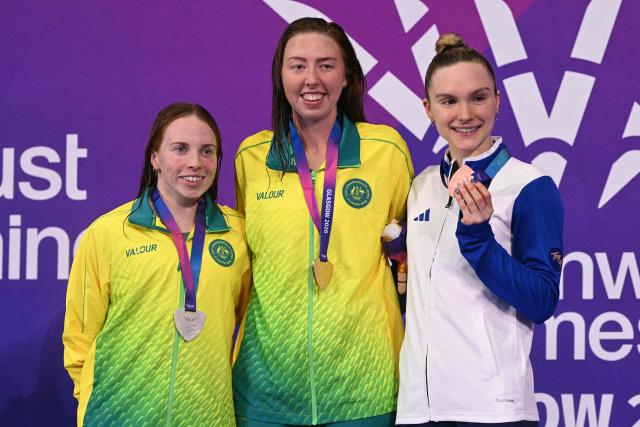 Silver medallist Australia's Emily Beecroft (L), gold medallist Australia's Lakeisha Patterson (C) and bronze medallist Scotland's Toni Shaw celebrate during the xx Medal Ceremony at the swimming event at the Tollcross International Swimming Centre in Glasgow, on day six of the Commonwealth Games in Glasgow, Scotland, on July 29, 2026. (Photo by Oli SCARFF / AFP)