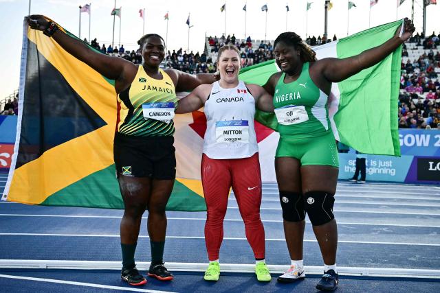 (From L) Third-placed Jamaica's Lloydricia Cameron, first-placed Canada's Sarah Mitton and second-placed Nigeria's Jessica Oji celebrate after competing in the women's shot put final during the athletics event at the Scotstoun Stadium in Glasgow, on day six of the Commonwealth Games in Glasgow, Scotland, on July 29, 2026. (Photo by Ben STANSALL / AFP)