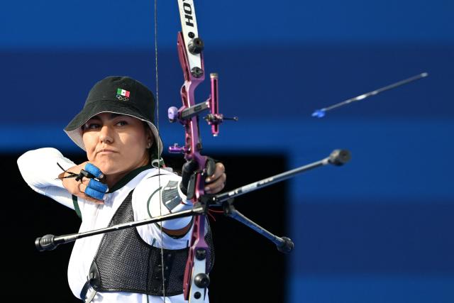 (FILES) Mexico’s Alejandra Valencia competes during the archery women’s individual elimination round during the Paris 2024 Olympic Games at the Esplanade des Invalides in Paris on August 3, 2024. "What I want to win is an individual medal at the Olympics – that’s the one I’m still missing," said Mexican archer Alejandra Valencia on July 29, 2026, reinforcing that ambition by winning two more gold medals at the 2026 Central American and Caribbean Games in Santo Domingo. (Photo by Punit PARANJPE / AFP)