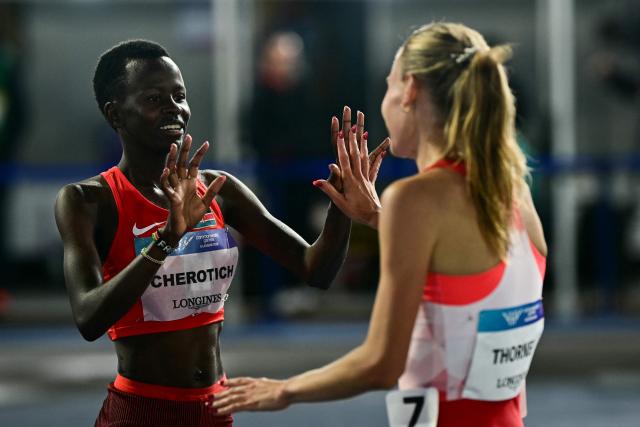 First-placed Kenya's Faith Cherotich (L) celebrates with second-placed England's Elise Thorner (R) after competing in the women's 3000m steeplechase final during the athletics event at the Scotstoun Stadium in Glasgow, on day six of the Commonwealth Games in Glasgow, Scotland, on July 29, 2026. (Photo by Ben STANSALL / AFP)