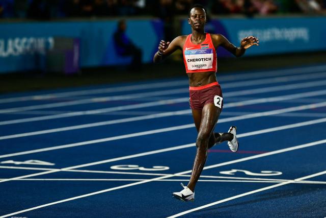 First-placed Kenya's Faith Cherotich celebrates as she crosses the finish line to win the women's 3000m steeplechase final during the athletics event at the Scotstoun Stadium in Glasgow, on day six of the Commonwealth Games in Glasgow, Scotland, on July 29, 2026. (Photo by Ben STANSALL / AFP)