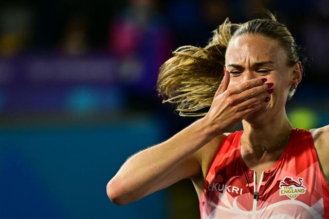 Second-placed England's Elise Thorner celebrates as she crosses the finish line in the women's 3000m steeplechase final during the athletics event at the Scotstoun Stadium in Glasgow, on day six of the Commonwealth Games in Glasgow, Scotland, on July 29, 2026. (Photo by Ben STANSALL / AFP)