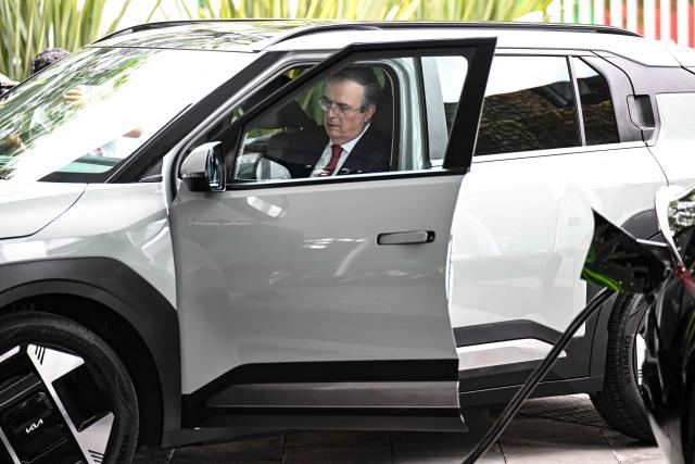 Mexican Economy Secretary Marcelo Ebrard sits inside a Kia EV3 electric vehicle during its presentation in Mexico City on July 29, 2026. Mexico announced on July 29 a multi-million-dollar investment by South Korean automaker Kia, amid tariff pressure maintained by the administration of US President Donald Trump on the sector and the threat of new levies. (Photo by Yuri CORTEZ / AFP)