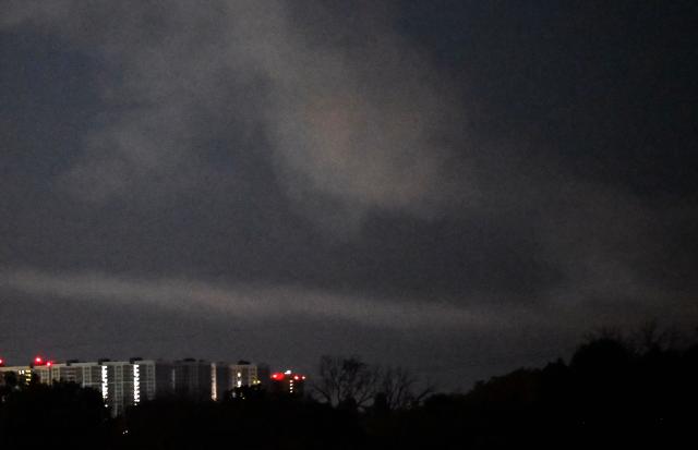 The photograph shows smoke in the sky following Russian ballistic missile strikes over the Ukrainian capital of Kyiv on July 30, 2026, amid the Russian invasion in Ukraine. Explosions were heard in Kyiv, an AFP journalist said, after President Volodymyr Zelensky said Russia would likely carry out another massive attack overnight. (Photo by Sergei SUPINSKY / AFP)