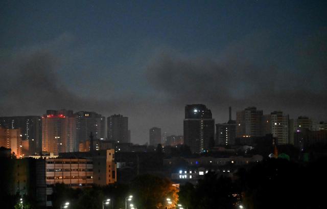 The photograph shows smoke in the sky following Russian ballistic missile strikes over the Ukrainian capital of Kyiv on July 30, 2026, amid the Russian invasion in Ukraine. Explosions were heard in Kyiv, an AFP journalist said, after President Volodymyr Zelensky said Russia would likely carry out another massive attack overnight. (Photo by Sergei SUPINSKY / AFP)