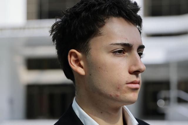 French teenager Didier Gaspard Owen Maximilien leaves the State Courts in Singapore on July 30, 2026. A French teenager pleaded guilty to a public nuisance charge in Singapore on July 30, for a straw-licking stunt that landed him in hot water in the city-state. (Photo by Suhaimi Abdullah / AFP)