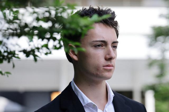 French teenager Didier Gaspard Owen Maximilien leaves the State Courts in Singapore on July 30, 2026. A French teenager pleaded guilty to a public nuisance charge in Singapore on July 30, for a straw-licking stunt that landed him in hot water in the city-state. (Photo by Suhaimi Abdullah / AFP)