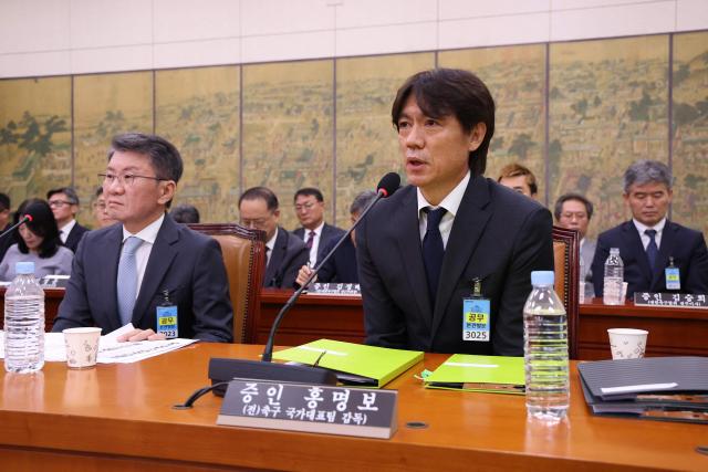 Former South Korean men's national team head coach Hong Myung-bo (R) and former KFA President Chung Mong-gyu (L) attend the hearing on the Korea Football Association (KFA) over a controversy surrounding its management at the National Assembly in Seoul on July 30, 2026. Hong, a former national team defender, resigned on July 26, after South Korea finished the World Cup 2026 group stage with one win and two losses, dashing hopes of a deep run led by captain Son Heung-min. (Photo by Chung Sung-Jun / POOL / AFP)