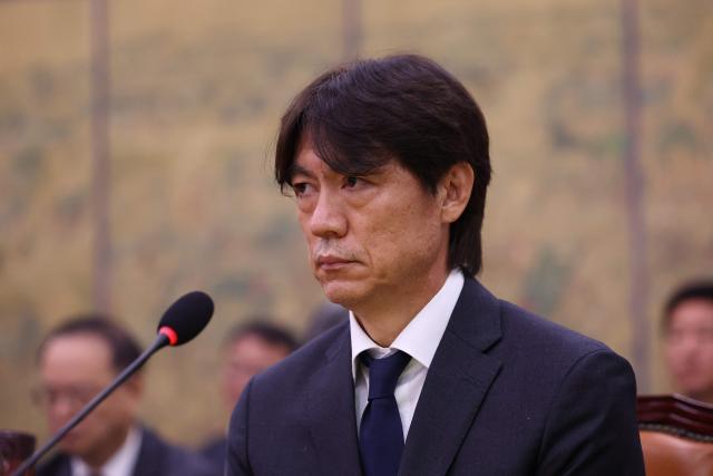 Former South Korean men's national team head coach Hong Myung-bo attends the hearing on the Korea Football Association (KFA) over a controversy surrounding its management at the National Assembly in Seoul on July 30, 2026. Hong, a former national team defender, resigned on July 26, after South Korea finished the World Cup 2026 group stage with one win and two losses, dashing hopes of a deep run led by captain Son Heung-min. (Photo by Chung Sung-Jun / POOL / AFP)