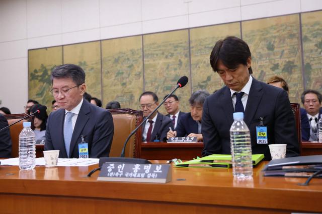 Former South Korean men's national team head coach Hong Myung-bo (R) and former KFA President Chung Mong-gyu (L) attend the hearing on the Korea Football Association (KFA) over a controversy surrounding its management at the National Assembly in Seoul on July 30, 2026. Hong, a former national team defender, resigned on July 26, after South Korea finished the World Cup 2026 group stage with one win and two losses, dashing hopes of a deep run led by captain Son Heung-min. (Photo by Chung Sung-Jun / POOL / AFP)