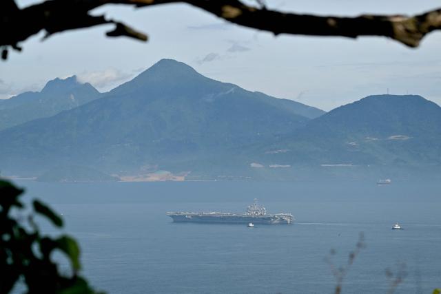The USS George Washington arrives at the port in Danang on July 30, 2026. (Photo by Nhac NGUYEN / AFP)