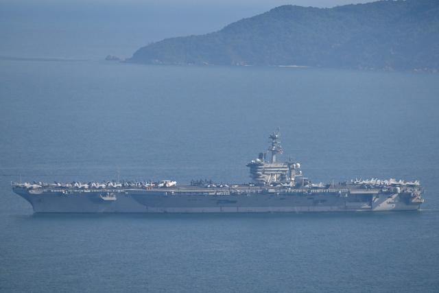 The USS George Washington arrives at the port in Danang on July 30, 2026. (Photo by Nhac NGUYEN / AFP)