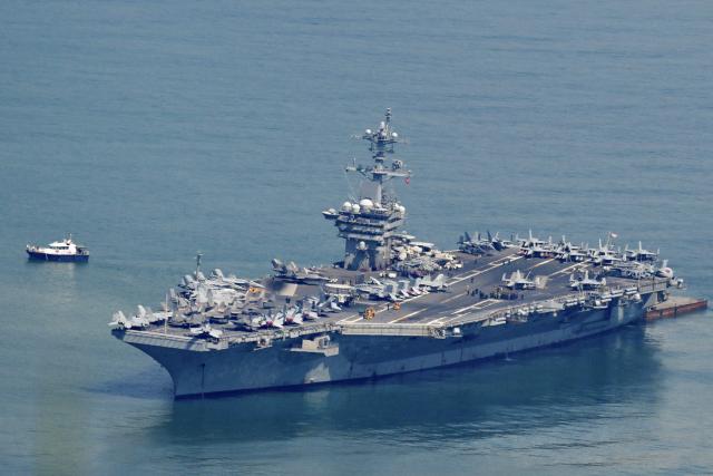 The USS George Washington arrives at the port in Danang on July 30, 2026. (Photo by Nhac NGUYEN / AFP)