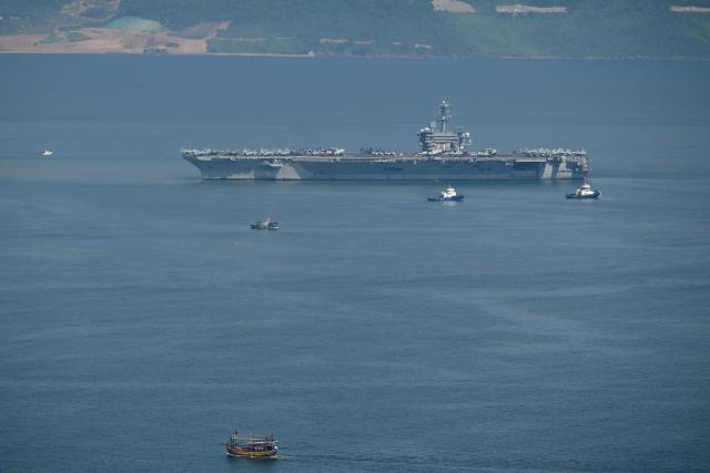 The USS George Washington arrives at the port in Danang on July 30, 2026. (Photo by Nhac NGUYEN / AFP)