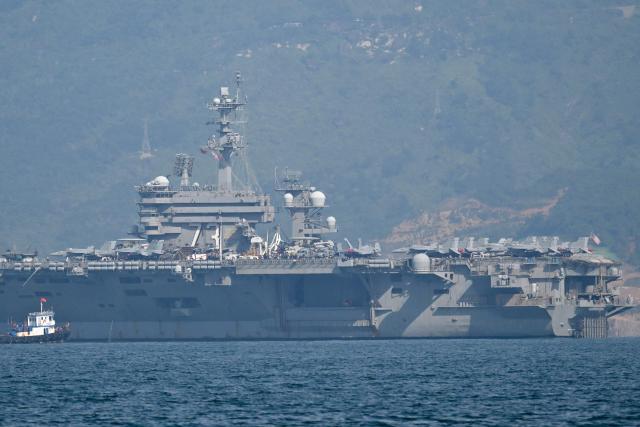 The USS George Washington arrives at the port in Danang on July 30, 2026. (Photo by Nhac NGUYEN / AFP)