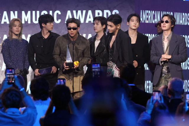 (FILES) South Korean boy band BTS accepts the Song of the Summer Award for "Swim" during the American Music Awards at the MGM Grand Garden Arena in Las Vegas, Nevada on May 25, 2026. Global K-pop sensation BTS said on July 29, 2026, they will not submit their music for next year's Grammy Awards, after the Recording Academy introduced a new Asian pop category criticised for restricting the success of regional artists. (Photo by VALERIE MACON / AFP)