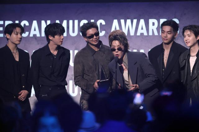 (FILES) South Korean boy band BTS accepts the Artist of the Year Award on stage during the American Music Awards at the MGM Grand Garden Arena in Las Vegas, Nevada on May 25, 2026. Global K-pop sensation BTS said on July 29, 2026, they will not submit their music for next year's Grammy Awards, after the Recording Academy introduced a new Asian pop category criticised for restricting the success of regional artists. (Photo by VALERIE MACON / AFP)