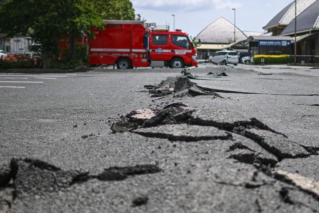 A cracked road is seen in Hikawa, Kumamoto Prefecture on July 30, 2026, after an earthquake struck southwestern Japan on July 28. (Photo by Philip FONG / AFP)