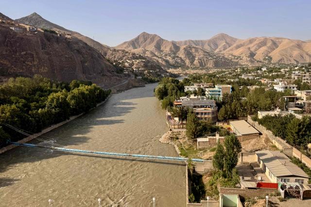 A general view shows the Kokcha River flowing through the Fayzabad district of Afghanistan's Badakhshan province on July 27, 2026. (Photo by Wakil KOHSAR / AFP)