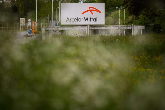 (FILES) This photograph shows a sign displaying the Arcelor Mital logo at the entrance to the Indre site, western France on April 24, 2025. Pleased with developments in European legislation, ArcelorMittal has seen its half-yearly sales boosted by steel prices (+4.9%), the company announced on July 30, 2026. (Photo by Loic VENANCE / AFP)
