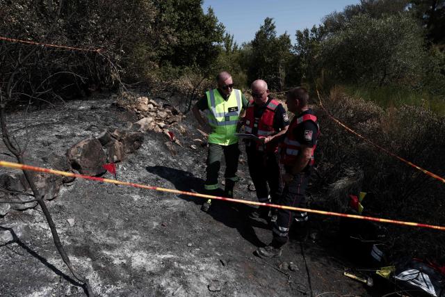 Members of the Recherche des Causes et Circonstances d'Incendie - RCCI of the Var department (Fire Causes and Circumstances Investigation) unit operate at the site of a suspected reignition point of a wildfire in Ponteves, south-eastern France on July 29, 2026. The RCCI comprises criminal investigation technicians from the French Gendarmerie, wildfire specialists from the fire service, and members of the National Forestry Office (ONF). Its role is to determine the cause of wildfires, including whether they were started deliberately or by natural causes. More than 600 people were evacuated on July 29, 2026, after a new fire broke out in the Var, south-east of Brignoles, spreading across about 100 hectares less than 24 hours after the Gros Bessillon wildfire, which burned 4,500 hectares over eight days, was brought under control. (Photo by Thibaud MORITZ / AFP)