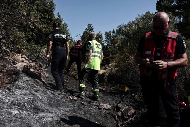 Members of the Recherche des Causes et Circonstances d'Incendie - RCCI of the Var department (Fire Causes and Circumstances Investigation) unit operate at the site of a suspected reignition point of a wildfire in Ponteves, south-eastern France on July 29, 2026. The RCCI comprises criminal investigation technicians from the French Gendarmerie, wildfire specialists from the fire service, and members of the National Forestry Office (ONF). Its role is to determine the cause of wildfires, including whether they were started deliberately or by natural causes. More than 600 people were evacuated on July 29, 2026, after a new fire broke out in the Var, south-east of Brignoles, spreading across about 100 hectares less than 24 hours after the Gros Bessillon wildfire, which burned 4,500 hectares over eight days, was brought under control. (Photo by Thibaud MORITZ / AFP)