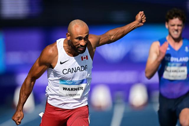 Canada's Damian Warner reacts as he crosses the finish line to arrive first in the men's decathlon 100m heat 2 during the athletics event at the Scotstoun Stadium in Glasgow, on day seven of the Commonwealth Games in Glasgow, Scotland, on July 30, 2026. (Photo by ANDY BUCHANAN / AFP)