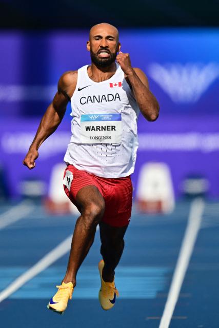 Canada's Damian Warner competes in the men's decathlon 100m heat 2 during the athletics event at the Scotstoun Stadium in Glasgow, on day seven of the Commonwealth Games in Glasgow, Scotland, on July 30, 2026. (Photo by ANDY BUCHANAN / AFP)