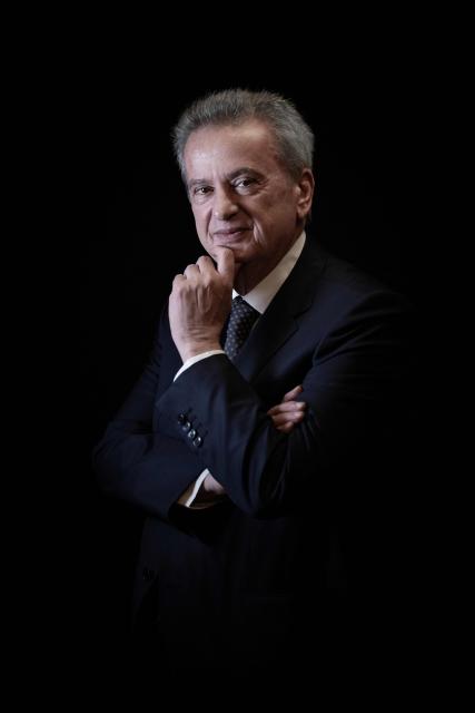 (FILES) Lebanon's Central Bank Governor Riad Salameh poses during a studio photo session in the capital Beirut, on December 20, 2021. Lebanese judicial authorities issued a court summons on July 30, 2026 for former Central Bank governor Riad Salameh after he failed to appear at a hearing over an embezzlement complaint, a judicial source told AFP. (Photo by Joseph EID / AFP)