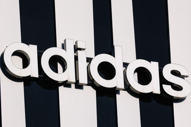 (FILES) This photograph shows a logo of Adidas, of the German sports equipment manufacturer, in Strasbourg, eastern France, on August 24, 2024. German sportswear maker Adidas missed profit expectations on July 30, 2026 after it reported results weighed by the costs of World Cup marketing, sending its shares down 17 percent. Core profit came in at 574 million euros (USD 657 million) for the three months to the end of June, Adidas said, higher than last year but about eight percent below expectations when compared to a poll of analysts by financial platform FactSet. (Photo by Abdesslam MIRDASS / AFP)