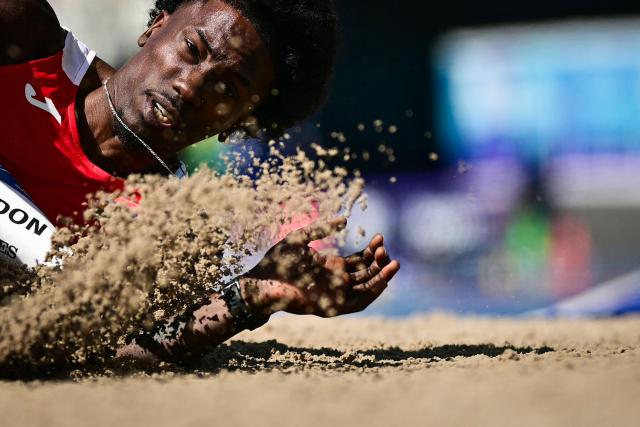 Mauritius' Adel Cupidon competes in the men's triple jump qualifying round during the athletics event at the Scotstoun Stadium in Glasgow, on day seven of the Commonwealth Games in Glasgow, Scotland, on July 30, 2026. (Photo by Ben STANSALL / AFP)