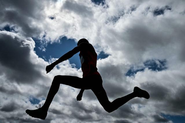Kenya's Isaac Kirwa Yego competes in the men's triple jump qualifying round during the athletics event at the Scotstoun Stadium in Glasgow, on day seven of the Commonwealth Games in Glasgow, Scotland, on July 30, 2026. (Photo by Ben STANSALL / AFP)