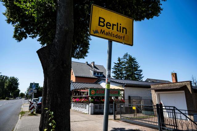 A road sign indicates the city of Berlin's boundary with Brandenburg, in Berlin's Mahlsdorf locality, on July 30, 2026. The German capital's boundaries date back to October 1, 1920 when the Greater Berlin Act came into effect, expanding Berlin's area overnight from 66 square kilometers to nearly 880 square kilometers. (Photo by John MACDOUGALL / AFP)