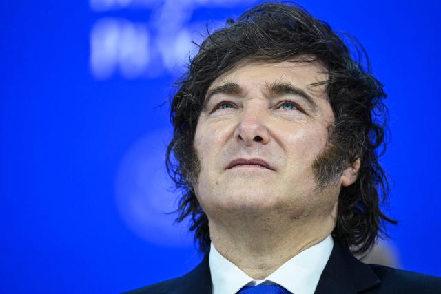 (FILES) Argentina's President Javier Milei looks on as he attends the "Board of Peace" meeting during the World Economic Forum (WEF) annual meeting in Davos on January 22, 2026. Argentine President Javier Milei has amended the Immigration Act by decree to ban the entry of foreign nationals who express hate speech against the South American country, according to the text published on July 29, 2026 evening, which is to be submitted to Congress. (Photo by Mandel NGAN / AFP)