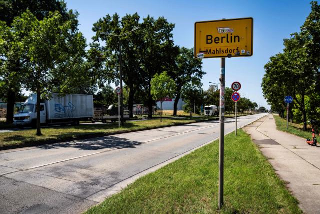 A road sign indicates the city of Berlin's boundary with Brandenburg, in Berlin's Mahlsdorf locality, on July 30, 2026. The German capital's boundaries date back to October 1, 1920 when the Greater Berlin Act came into effect, expanding Berlin's area overnight from 66 square kilometers to nearly 880 square kilometers. (Photo by John MACDOUGALL / AFP)