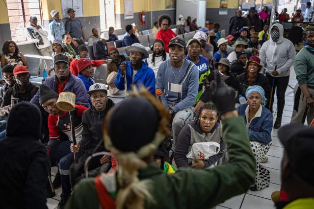 A protest leader addresses protesters after storming the Department of Home Affair offices during a demonstration calling for the removal of undocumented immigrants in Alexandra township on July 30, 2026. South African President Cyril Ramaphosa called on July 27 for African countries to work together to manage migration, as his government faces mounting pressure over attacks on foreign nationals. Ramaphosa's appeal to the Pan-African Parliament follows weeks of anti-migrant protests in South Africa, where xenophobic activists and fringe groups have blamed undocumented migrants from elsewhere in Africa for crime, unemployment and strain on public services. (Photo by EMMANUEL CROSET / AFP)
