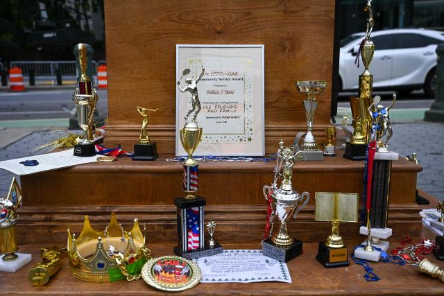A satirical "Iran War Participation Trophy" is seen in Lower Manhattan in New York City on July 30, 2026. The satirical work is the latest installment by a group of anonymous artists that aim to mock US President Donald Trump. (Photo by Angela WEISS / AFP)