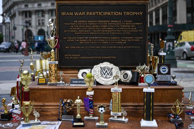 A satirical "Iran War Participation Trophy" is seen in Lower Manhattan in New York City on July 30, 2026. The satirical work is the latest installment by a group of anonymous artists that aim to mock US President Donald Trump. (Photo by Angela WEISS / AFP)