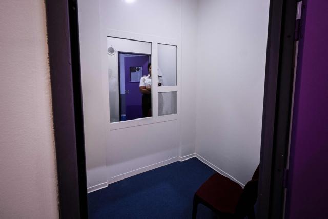 Caroline Vayr, Reau prison deputy director, stands into one of the five ‘hygienic visiting rooms’ at the third organised crime unit (drug-trafficking district) during a press tour at Reau Prison, near Paris on July 30, 2026. A third organised crime unit is set to open in France in the coming weeks, at Rйau prison (Seine-et-Marne), one year after the first such unit opened in Pas-de-Calais, the prison service announced on July 30, 2026 during a press tour of the facility. (Photo by Lou BENOIST / AFP)