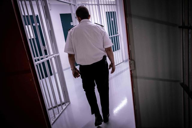 Olivier Pipino, Reau prison director, walks at the third organised crime unit (drug-trafficking district) during a press tour at Reau Prison, near Paris on July 30, 2026. A third organised crime unit is set to open in France in the coming weeks, at Réau prison (Seine-et-Marne), one year after the first such unit opened in Pas-de-Calais, the prison service announced on July 30, 2026 during a press tour of the facility. (Photo by Lou BENOIST / AFP)
