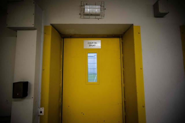 This photograph shows the outdoor courtyard door of the third organised crime unit (drug-trafficking district) during a press tour at Reau Prison, near Paris on July 30, 2026. A third organised crime unit is set to open in France in the coming weeks, at Réau prison (Seine-et-Marne), one year after the first such unit opened in Pas-de-Calais, the prison service announced on July 30, 2026 during a press tour of the facility. (Photo by Lou BENOIST / AFP)