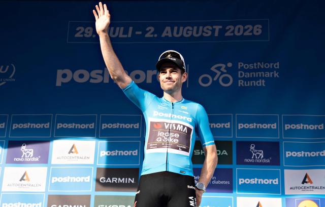 Team Visma | Lease a Bike's Belgian rider Wout Van Aert celebrates after being declared the winner of the 2. stage of PostNord Danmark Rundt instead of Alpecin - Premier Tech Australian rider Jensen Plowright after review of the photo finish, and wears the blue leader's jersey on July 30, 2026 in Skive, Denmark. The stage 2 is 187.2 kilometers long and runs from Glyngoere to Skive. (Photo by Henning Bagger / Ritzau Scanpix / AFP) / Denmark OUT