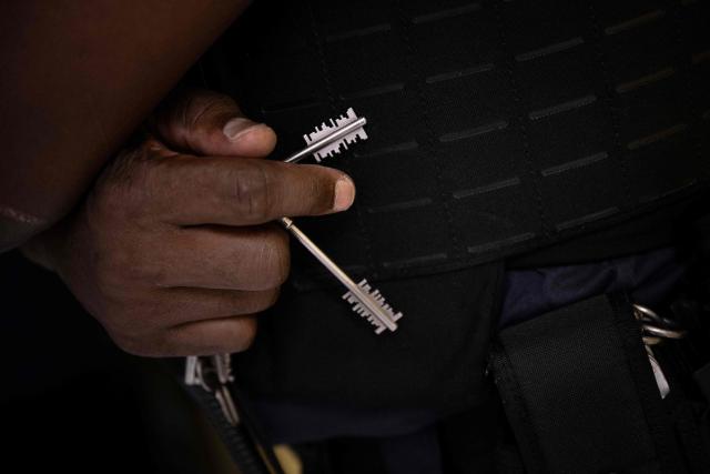 A prison officer holds keys at the third organised crime unit (drug-trafficking district) during a press tour at Reau Prison, near Paris on July 30, 2026. A third organised crime unit is set to open in France in the coming weeks, at Réau prison (Seine-et-Marne), one year after the first such unit opened in Pas-de-Calais, the prison service announced on July 30, 2026 during a press tour of the facility. (Photo by Lou BENOIST / AFP)