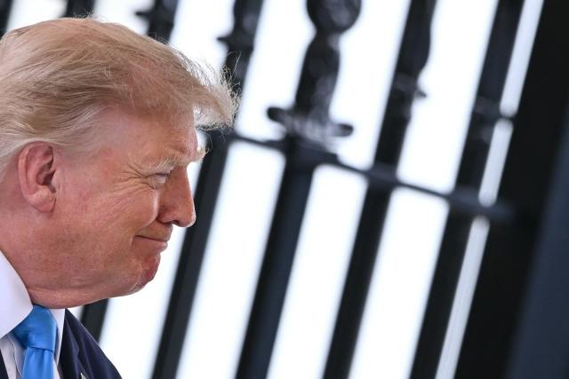 US President Donald Trump looks on during an event about the Freedom Haulers program at the White House in Washington, DC, on July 30, 2026. The Freedom Haulers program aims to assist military veterans in becoming commercial truck drivers while cracking down on non-English speaking drivers. (Photo by Brendan SMIALOWSKI / AFP)