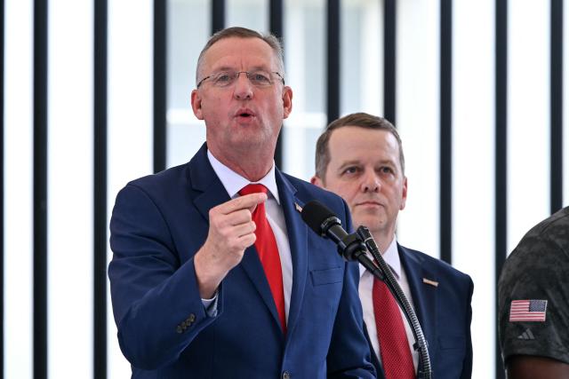 US Secretary for Veterans Affairs Doug Collins (L) speaks alongside Werner Enterprises President Nathan Meisgeier  during an event about the Freedom Haulers program at the White House in Washington, DC, on July 30, 2026. The Freedom Haulers program aims to assist military veterans in becoming commercial truck drivers while cracking down on non-English speaking drivers. (Photo by Brendan SMIALOWSKI / AFP)