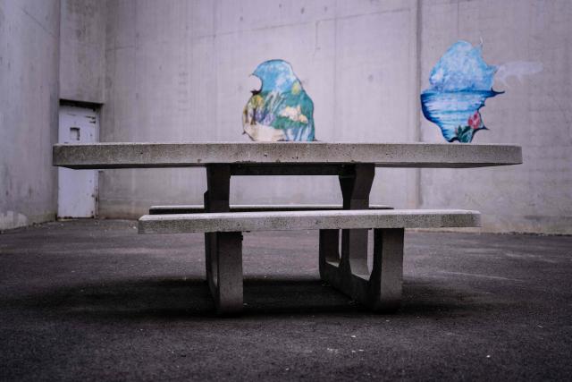 This photograph shows a bench in the outdoor courtyard of the third organised crime unit (drug-trafficking district) during a press tour at Reau Prison, near Paris on July 30, 2026. The third organised crime unit is set to open in France in the coming weeks, at Réau prison (Seine-et-Marne), one year after the first such unit opened in Pas-de-Calais, the prison service announced on July 30, 2026 during a press tour of the facility. (Photo by Lou BENOIST / AFP)