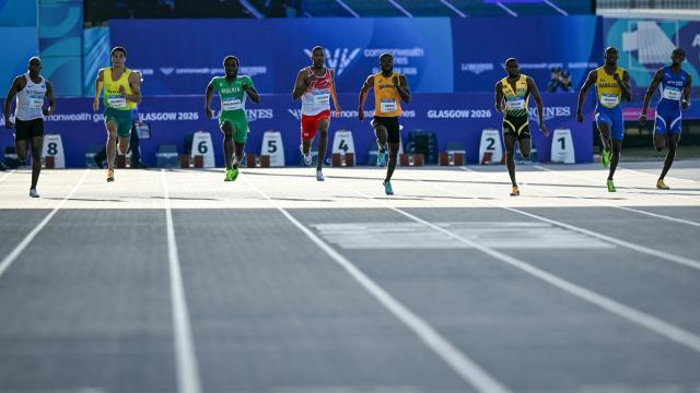 (From L) Botswana's Justice Oratile, Australia's Aidan Murphy, Nigeria's Udodi Chudi Onwuzurike, England's Zharnel Hughes, Ghana's James Dadzie, Jamaica's Christopher Taylor, Barbados' Kuron Griffith, British Virgin Islands' Wanyae Belle compete in the men's 200m semi-finals during the athletics event at the Scotstoun Stadium in Glasgow, on day seven of the Commonwealth Games in Glasgow, Scotland, on July 30, 2026. (Photo by ANDY BUCHANAN / AFP)
