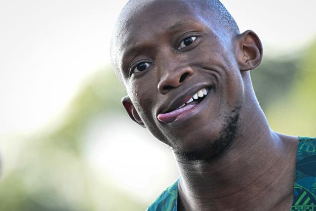 South Africa's Sinesipho Dambile reacts after arriving first in the men's 200m semi-finals 3 during the athletics event at the Scotstoun Stadium in Glasgow, on day seven of the Commonwealth Games in Glasgow, Scotland, on July 30, 2026. (Photo by ANDY BUCHANAN / AFP)