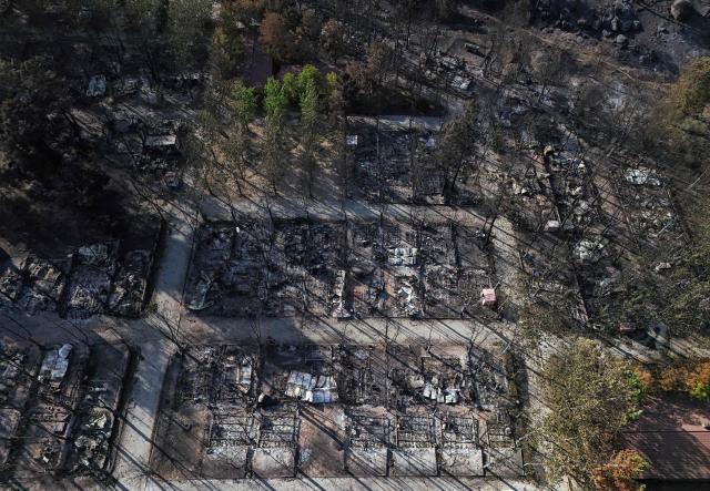 Aerial view of burnt pitches at the Valle de Iruelas camping, near El Tiemblo, in Avila province, Spain on July 30, 2026. Spanish Prime Minister Pedro Sanchez today lifted the state of emergency over the wildfires in Madrid and Avila regions that forced the evacuations of tens of thousands of people. Wildfires have stopped spreading and there are "almost no flames", Spanish authorities said. But they warned that the ongoing heatwave threatens a resurgence of fire in areas west of Madrid, where more than 25,000 hectares (61,776 acres) have already gone up in smoke. (Photo by OSCAR DEL POZO / AFP)