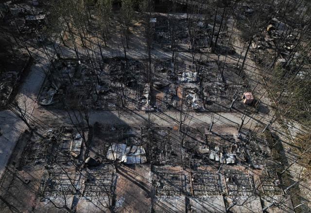Aerial view of burnt pitches at the Valle de Iruelas camping, near El Tiemblo, in Avila province, Spain on July 30, 2026. Spanish Prime Minister Pedro Sanchez today lifted the state of emergency over the wildfires in Madrid and Avila regions that forced the evacuations of tens of thousands of people. Wildfires have stopped spreading and there are "almost no flames", Spanish authorities said. But they warned that the ongoing heatwave threatens a resurgence of fire in areas west of Madrid, where more than 25,000 hectares (61,776 acres) have already gone up in smoke. (Photo by OSCAR DEL POZO / AFP)